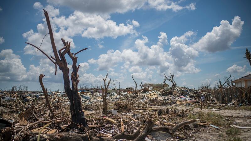 A resident walks down a path in the decimated Pigeon Peas neighbourhood in Marsh Harbour. Photograph: Daniele Volpe/The New York Times