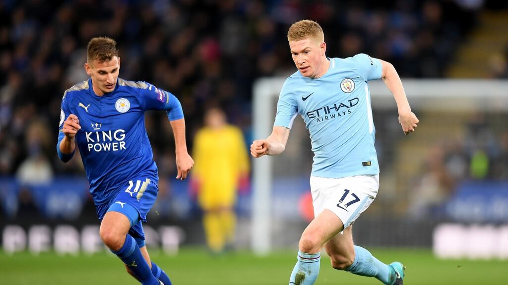 Manchester City striker Kevin De Bruyne takes on Vicente Iborra of Leicester City. Photograph: Photograph: Michael Regan/Getty Images