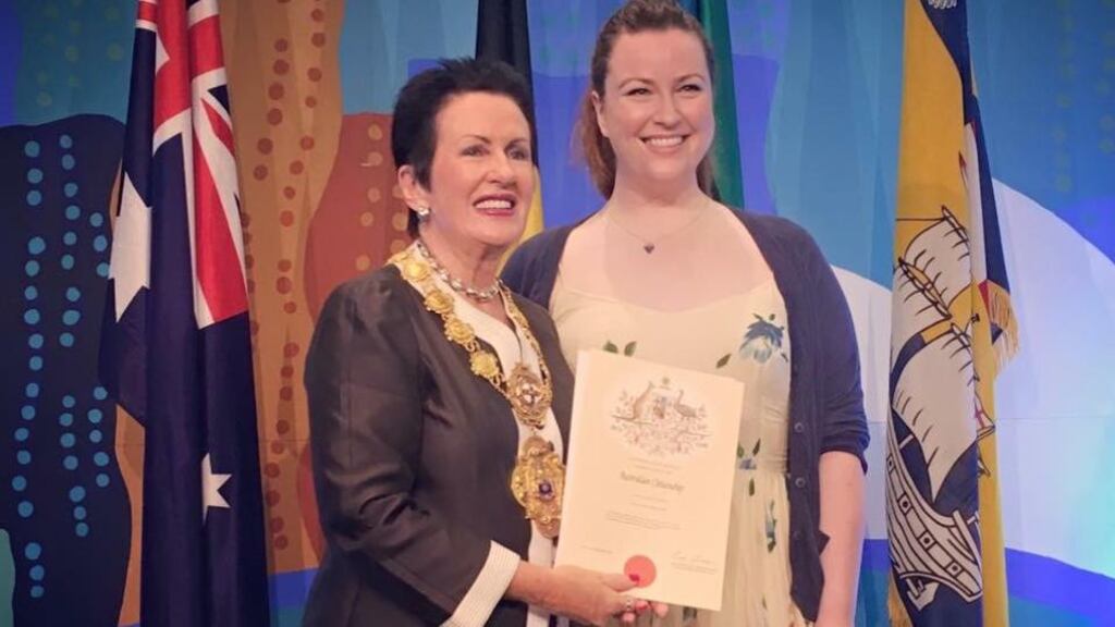 Laura Brown gets her citizenship from mayor of Sydney Clover Moore.