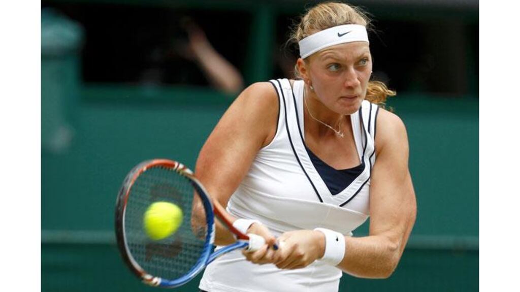 Petra Kvitova of the Czech Republic hits a return durign her sem-final win over Victoria Azarenka to reach the Wimbledon final for the first time. Photograph: Eddie Keogh/Reuters