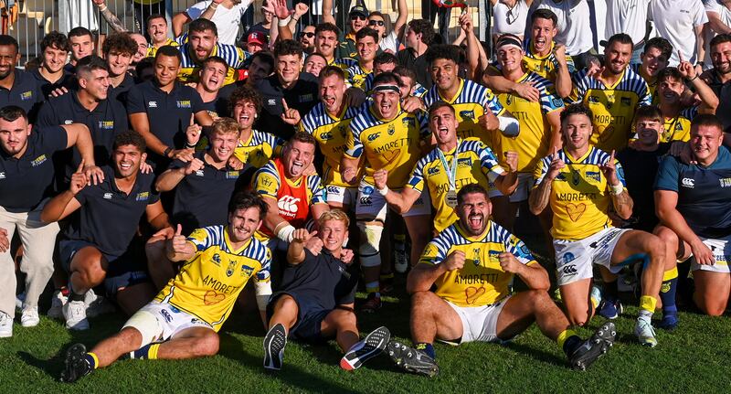 Zebre players and management celebrate after beating Munster for the first time. Photograph: Luca Sighinolfi/Inpho
