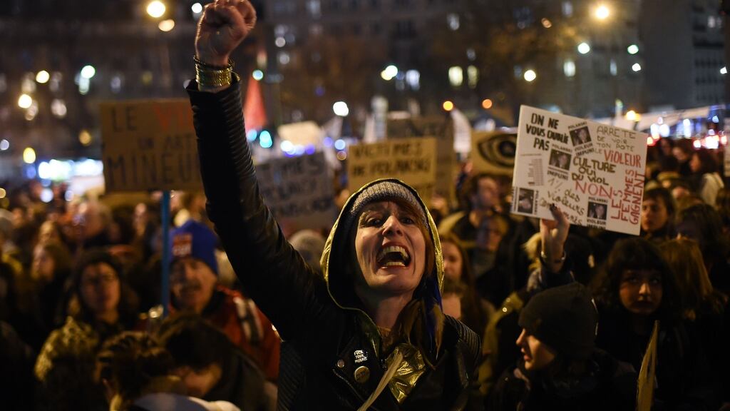 An activist in full flight outside the Salle Pleyel in Paris as guests arrive for the 45th edition of the Cesar Film Awards. Photograph: AFP/Getty