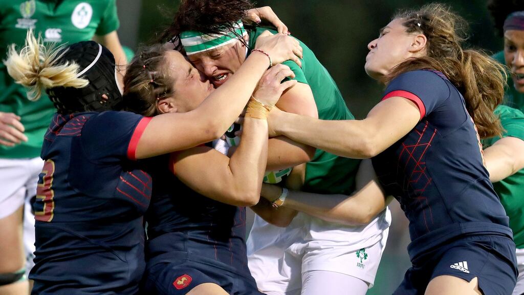 Ireland’s Lindsay Peat is tackled during the Women’s Rugby World Cup Pool C game against France at the UCD Bowl. Photograph: Dan Sheridan/Inpho