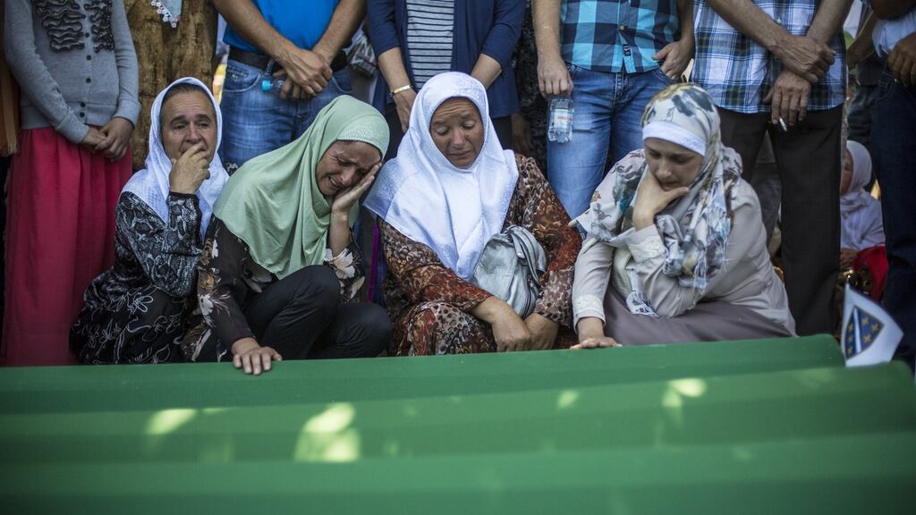 Mourn over the coffin before the mass funeral for 136 newly-identified victims of the 1995 Srebrenica massacre attended by tens of thousands of mourners in July. Photograph:Matej Divizna/Getty Images