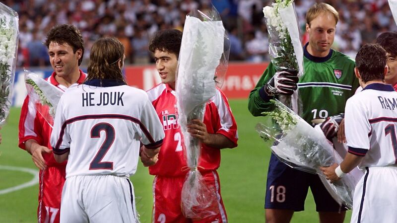 Iranian players offer flowers to US players before the 1998  World Cup Group F first-round match in Lyon. Iran won 2-1. Photograph: Patrick Kovarik/AFP/Getty Images