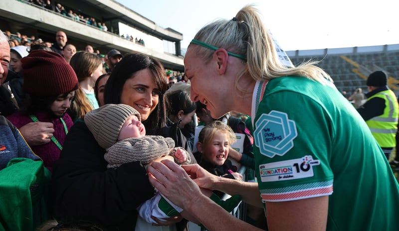 Louise Quinn with her son Darragh after her final appearance for Ireland against Slovenia in Cork last Tuesday. Photograph: Ryan Byrne/Inpho