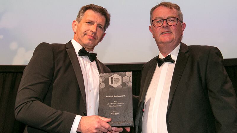 Enda Murphy, Head of Engineering, Ardmac, presents the Health and Safety Award to Padraic O'Neill, Pfizer.