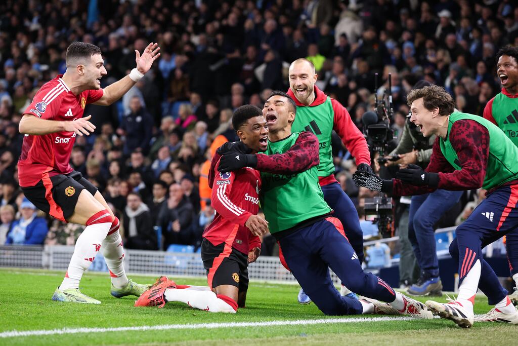 Amad Diallo of Manchester United celebrates with team-mates after scoring his side's winner in the Manchester derby. Photograph: Alex Livesey - Danehouse/Getty Images
