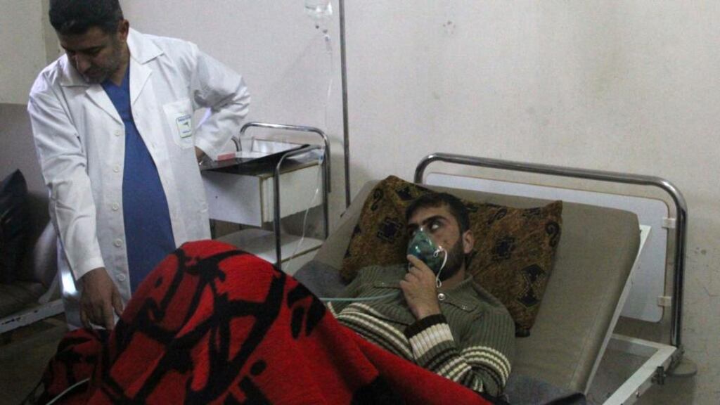A man, affected by what activists say was a gas attack, breathes through an oxygen mask inside a field hospital in Kfar Zeita village in the central province of Hama April 12th. Photograph: Stringer /Reuters