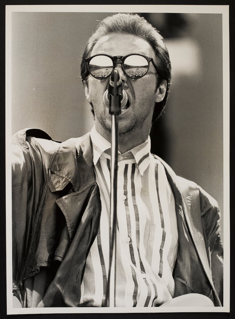 Close up of Midge Ure (Ultravox) on stage at Wembley, with reflection of audience in sunglasses
Photographer credit: Jeremy Mitchell: Band Aid Archive courtesy © The National Library of Ireland.
