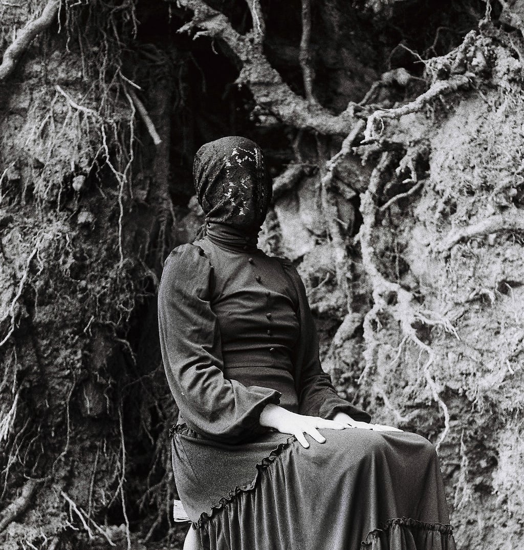 Fermanagh singer and producer Róis wears a red nylon mask, giving a spectral aura