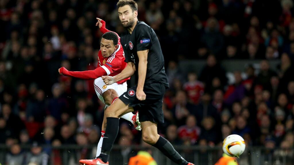 Manchester United’s Memphis Depay scores his team’s fifth goal at Old Trafford. Photograph: Martin Rickett/PA