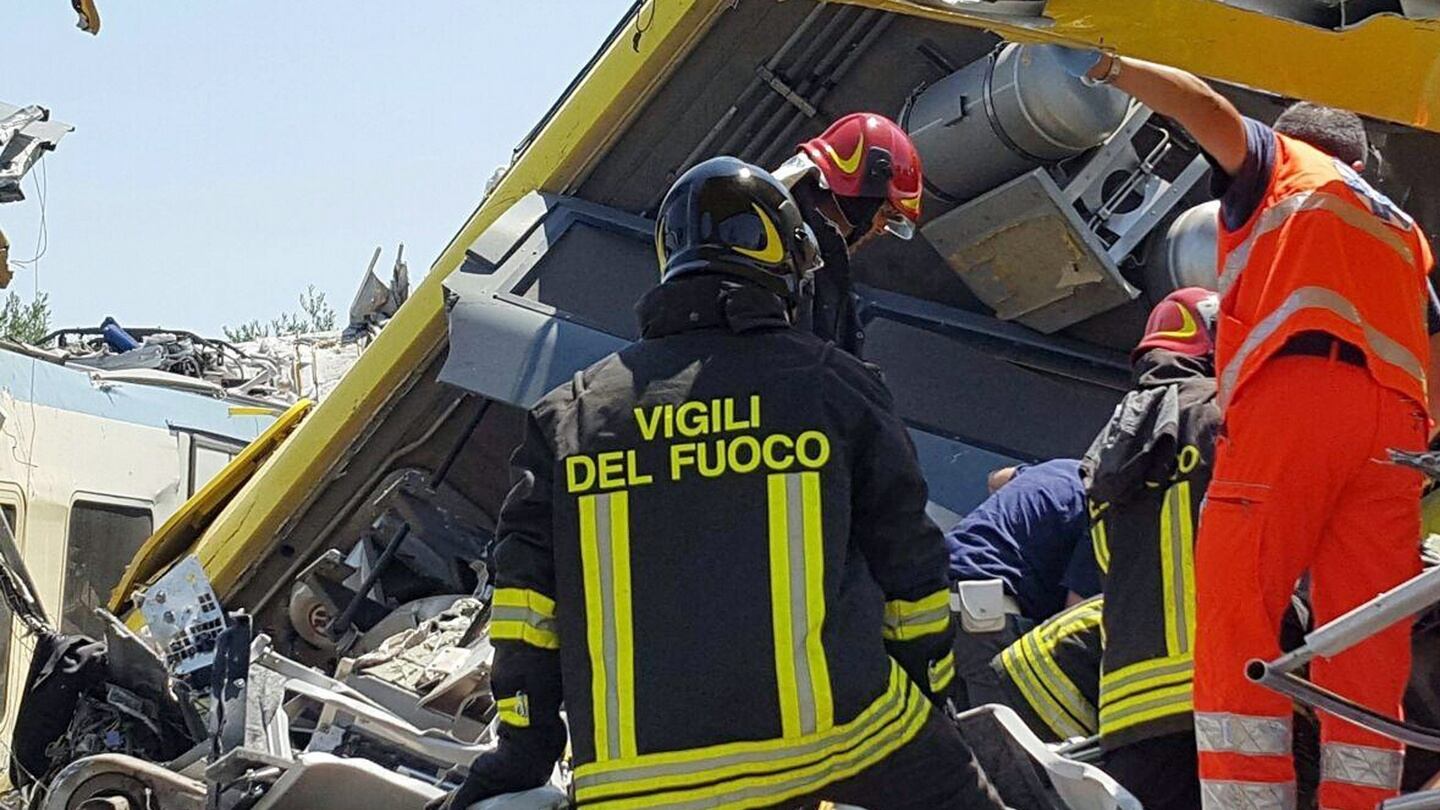 Emergency services working at the crash site where two trains collided. Photograph: EPA/Italian Fire Brigade