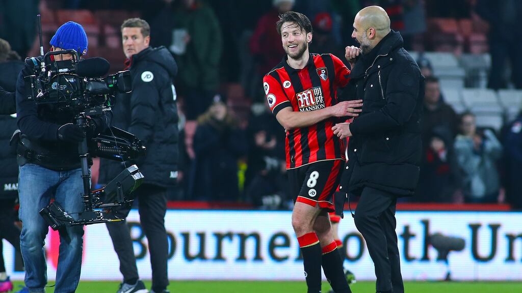 Manchester City manager Pep Guardiola talks to Bournemouth’s Harry Arter after the final whistle on Monday night. Photograph: Mark Kerton/Action Plus via Getty Images