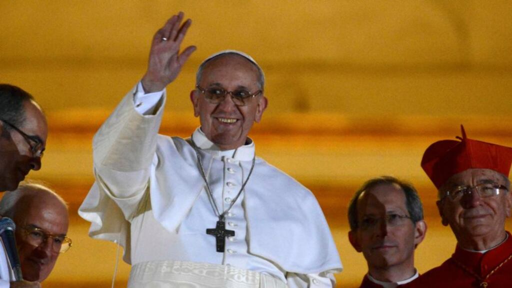 Newly elected Pope Francis, Cardinal Jorge Mario Bergoglio of Argentina appears on the balcony of St Peter's Basilica after being elected by the conclave of cardinals. Photograph: Reuters