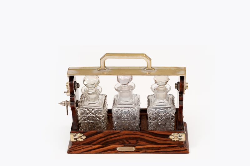 19th-century set of three cut glass whiskey decanters in original oak Tantalus from Mappin and Webb, €1,500-€2,000, O'Sullivan Antiques