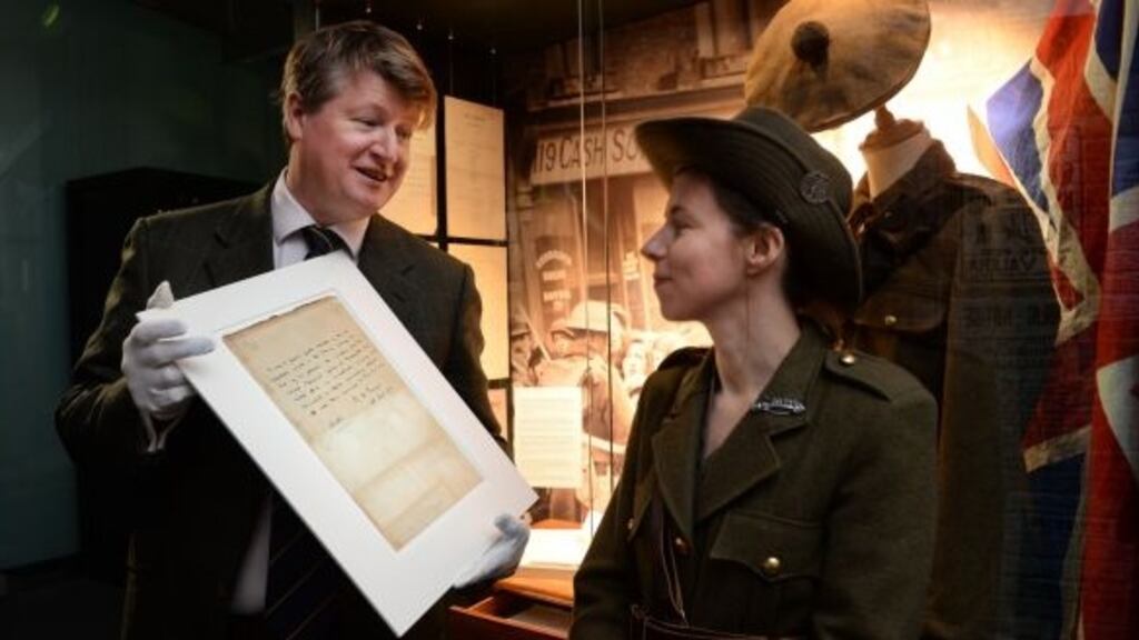 Stuart Cole, director, Adams Fine Art Auctioneers, with actor Sarah Kinlen, holding the historic Patrick Pearse letter. File photograph: Cyril Byrne/The Irish Times