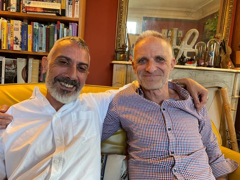 Bernard Phelan and his husband Roland Bonello (left) in their home in Paris. Photograph: Lara Marlowe