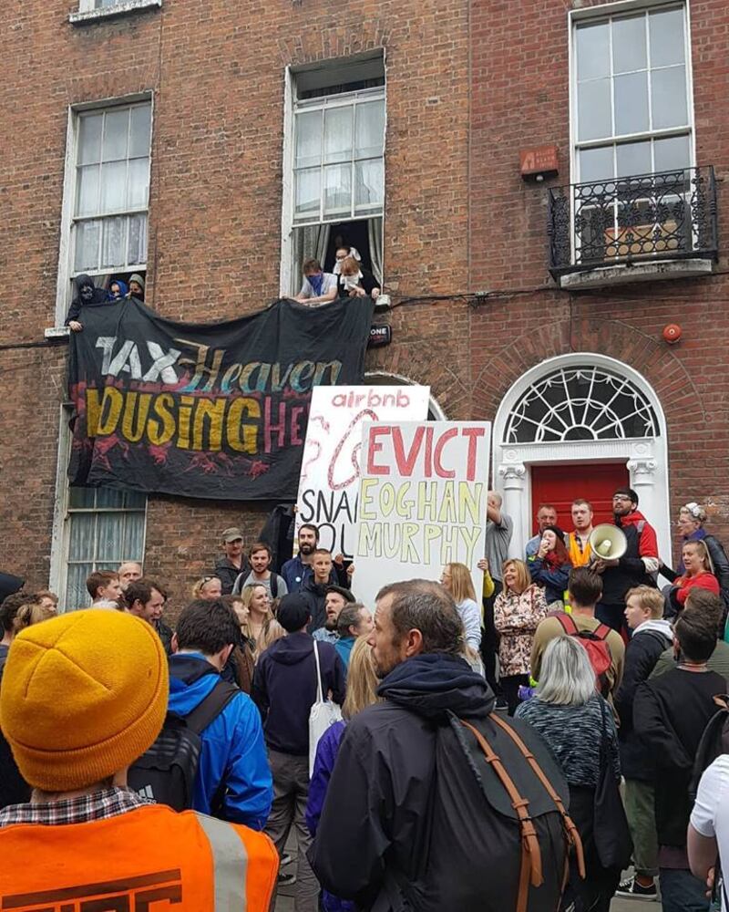 Protesters at 41 Belvadere Place on Wednesday
