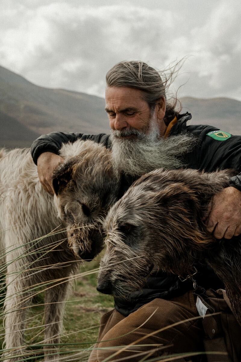 Tour guide Aidan O'Sullivan and his two Irish wolfhounds Spéir and Mairtín on Bertra Beach, Co Mayo. Photograph: Ellie Thorne