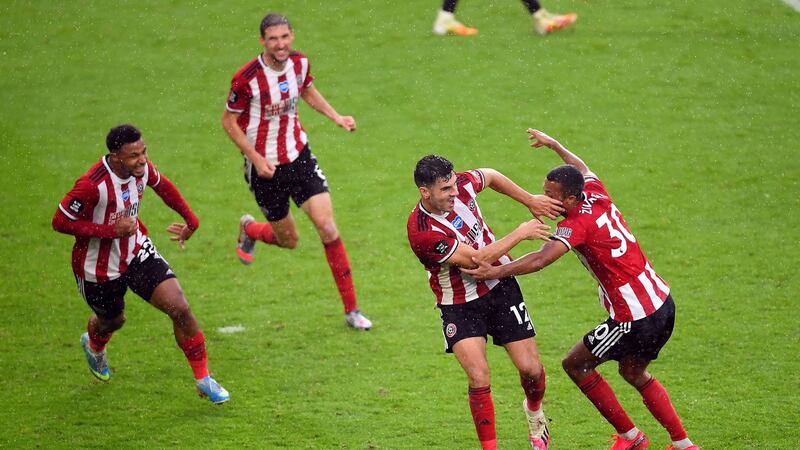 Sheffield United celebrate John Egan’s late winner against Wolves. Photograph: Laurence Griffiths/PA