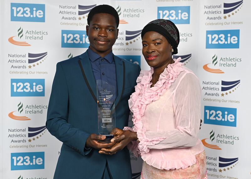 The awards for Rhasidat Adeleke is collected on her behalf by her mother Adewumi Ademola and brother Abdullahi Adeleke. Photograph: Sam Barnes/Sportsfile