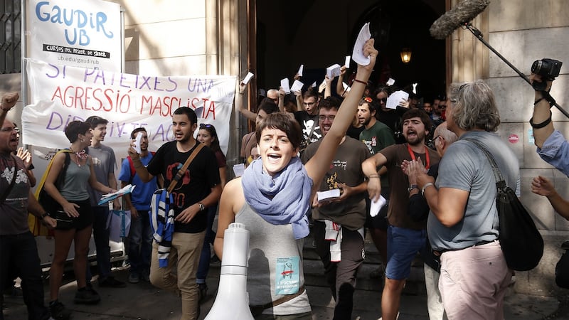 Students shout slogans and wave Catalan referendum voting cards during a demonstration called for by the Catalan National Assembly and Omnium Cultural outside the University of Barcelona. Photograph: Pau Barrena/Bloomberg