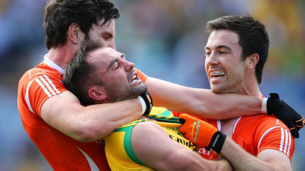 Donegal’s Karl Lacey tangles with Aaron Findon and Aidan Forker of Armagh. Photograph: Cathal Noonan/Inpho