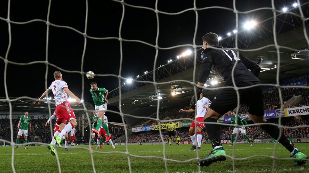 Northern Ireland’s Jonny Evans scores against Belarus. Photograph: Reuters