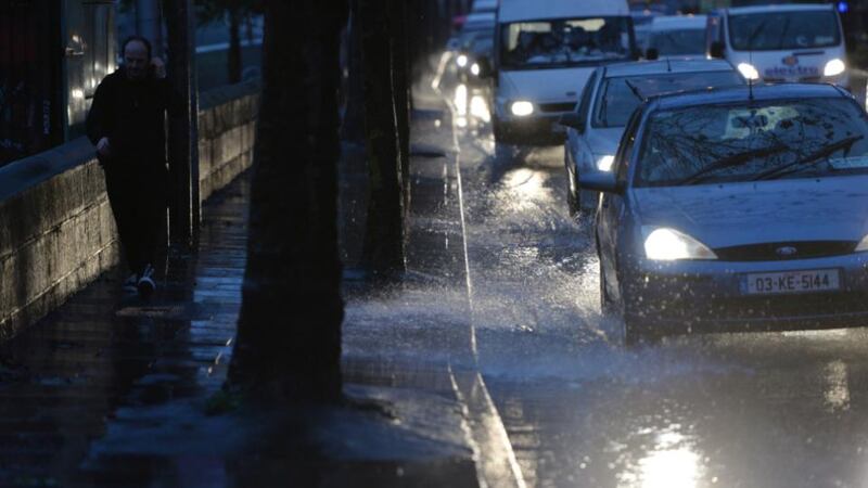 Cars make their way up the Quays in Dublin amid heavy rain, December 3rd, 2015. Photograph: Alan Betson/The Irish Times
