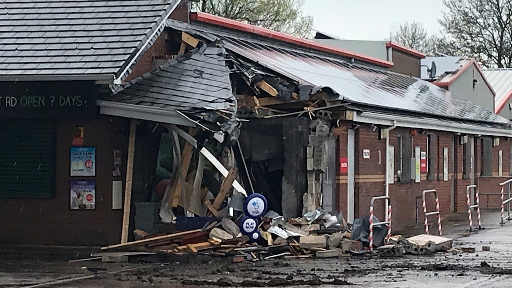 The scene at a fuel station at Tully Road, Nutts Corner, Antrim, where a digger was used to rip an ATM from the wall. Photograph: Rebecca Black/PA Wire