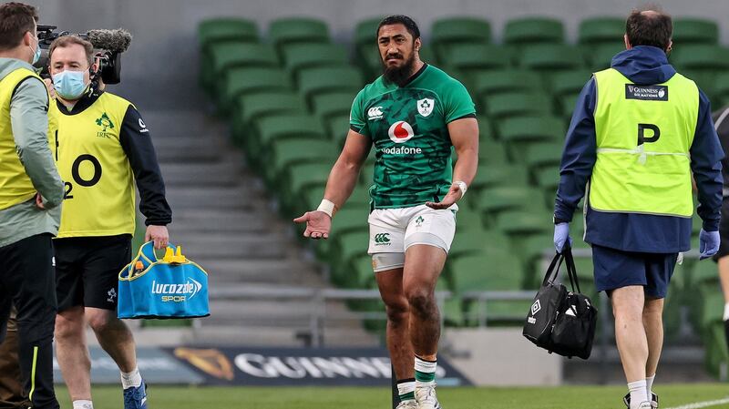 Bundee Aki leaves the pitch after being shown a red card. Photo: Billy Stickland/Inpho