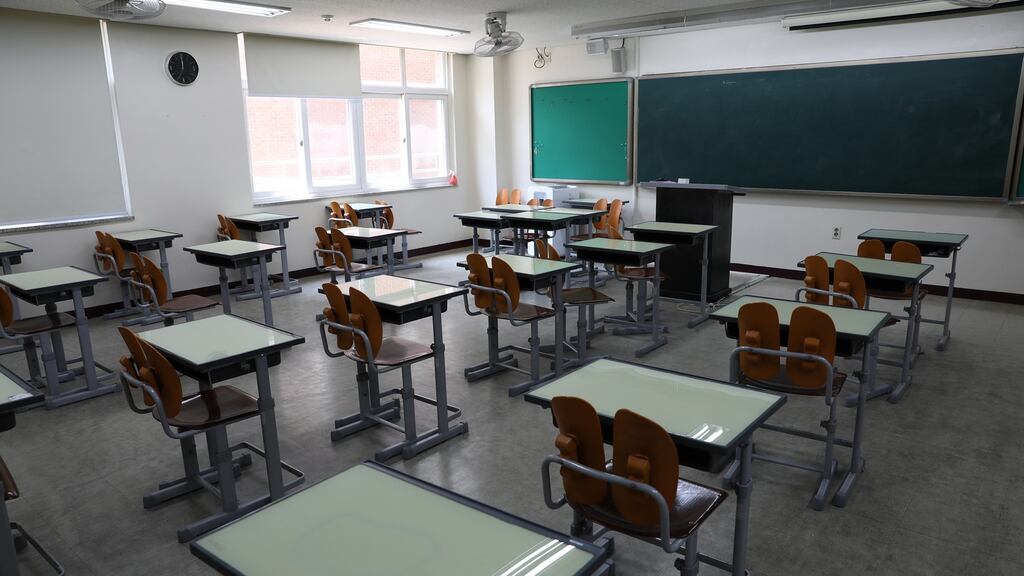 The man claims his older son faces grave risk if he is obliged to wear a mask in school in France. File photograph: Chung Sung-Jun/Getty Images