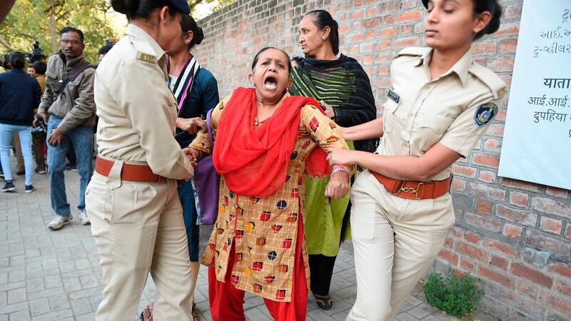 Gujarat police officials detain a demonstrator during a peaceful protest against the Indian government’s Citizenship Amendment Bill in Ahmedabad on Monday. Photograph: Sam Panthaky/AFP via Getty Images
