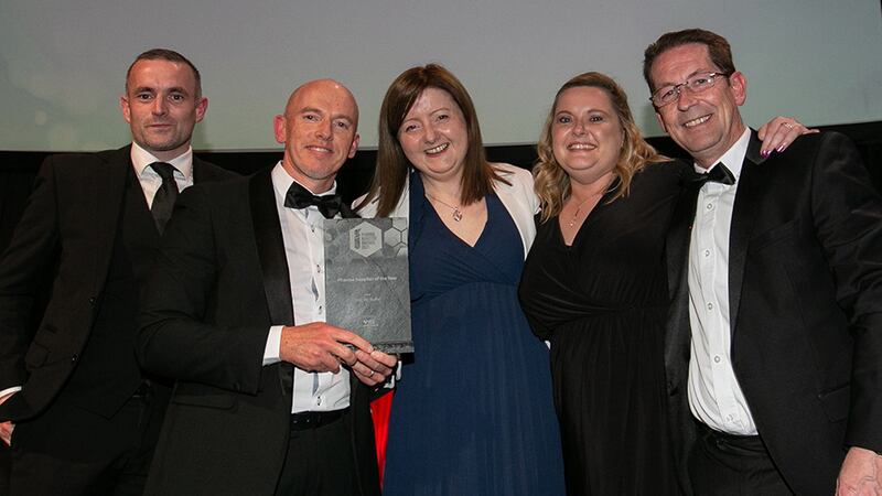 Kevin Hoban, Director, H2 COMPLIANCE IRL, presents the Pharma Supplier of the Year Award to the A&C Bio Buffer team.