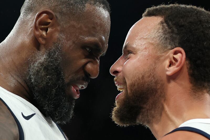 LeBron James and Stephen Curry celebrate the United States' basketball semi-final win over Serbia. Photograph: Gregory Shamus/Getty Images
