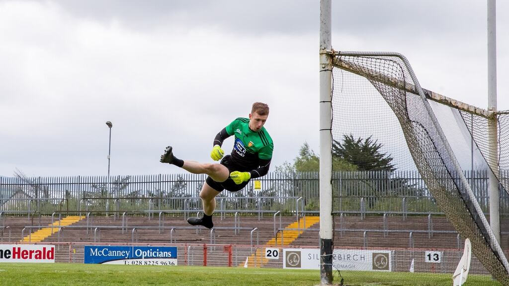 Donegal goalkeeper Seán Patton makes a spectacular save during the Allianz Football League Division One North game against Tyrone at Healy Park in Omagh. Crowds of 500 will be able to attend games in the North from Monday. Photograph: Morgan Treacy/Inpho