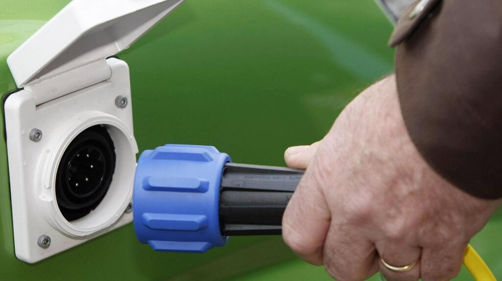 Charging an electric car. As VW negotiates the terms of compensation, engine fixes and car recalls for its massive fraud in the US, it stands to benefit from a German e-car stimulus programme co-financed by taxpayers and the industry.