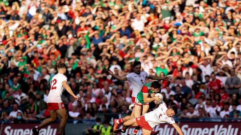 Mayo’s Lee Keegan with Darren McCurry of Tyrone. Photo: Tommy Dickson/Inpho