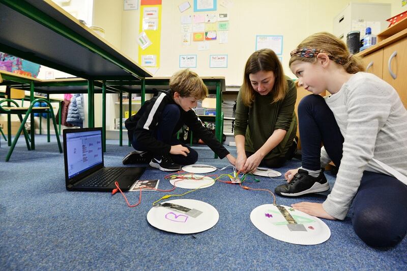 Joanne Mullan with Conn and Meabh Butler attending the workshop at the Educate Together National School. Photograph: Alan Betson