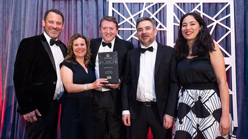 Graham Harding, sales director, Noyeks Newmans presents the building of the year to the DMVF Architects team