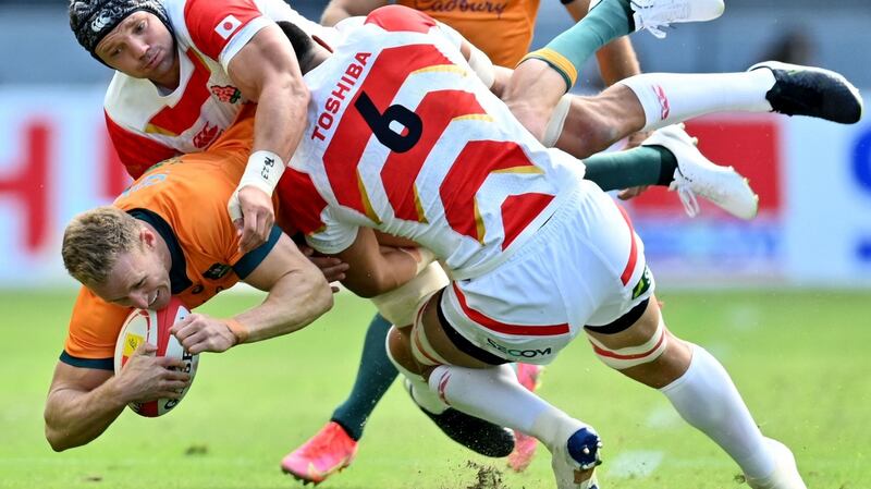 Australia’s Reece Hodge is tackled by Japan’s Ben Gunter during Tst match at the Oita Stadium. Photograph: Charly Triballeau/AFP via Getty Images