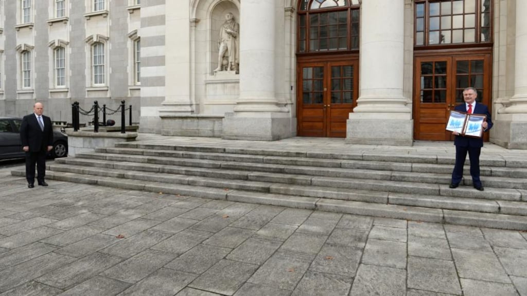 Minister for Finance Michael Noonan and Minister for Public Expenditure Brendan Howlin at a pre-budget photocall last week: in percentage terms, a person earning €70,000 will be 1.9 per cent better off, whereas a person earning €20,000 a year will be about 1.1 per cent better off. Photograph: Dara Mac Dónaill