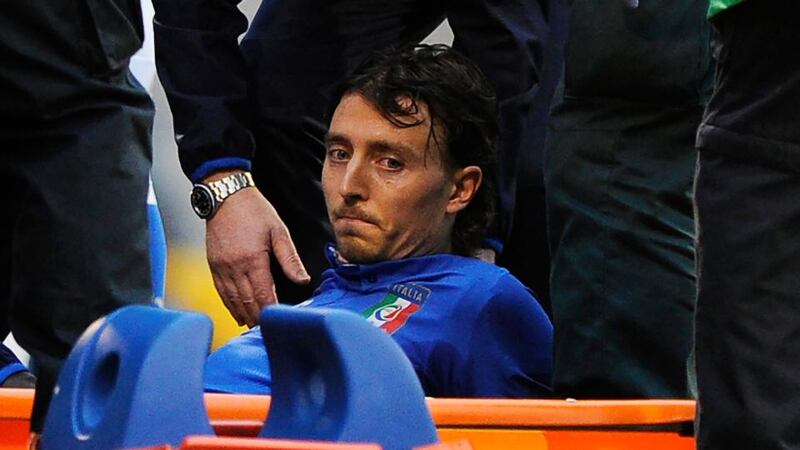 Italy’s Riccardo Montolivo before being stretchered off with a suspected broken ankle at Craven Cottage. Photograph: Facundo Arrizabalaga / EPA