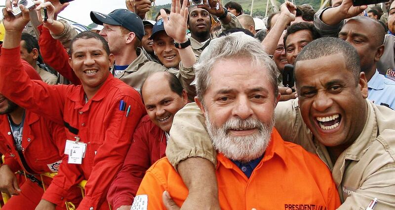 Brazil’s president Luiz Inacio Lula da Silva (second from right) greets employees of Brazilian oil giant Petrobras during the opening ceremony of the Petrobras 51 oil rig near Rio de Janeiro, in 2008. Photograph: Ricardo Stuckert/Reuters