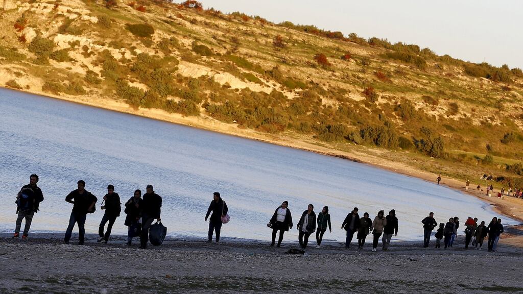 Refugees walk along a beach before trying to travel to the Greek island of Chios from the western Turkish coastal town of Cesme, in Izmir province, Turkey, on March 5th. Photograph: Umit Bektas/Reuters