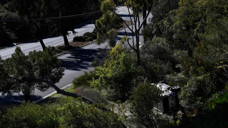 The vehicle driven  by golfer Tiger Woods lies on its side in Rancho Palos Verdes, California after a rollover accident. Photograph:   Patrick T Fallon/AFP via Getty Images