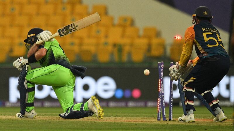 Ireland’s Curtis Campher is bowled out by Sri Lanka’s Maheesh Theekshana. Photograph: Indranil Mukherjee/AFP via Getty Images