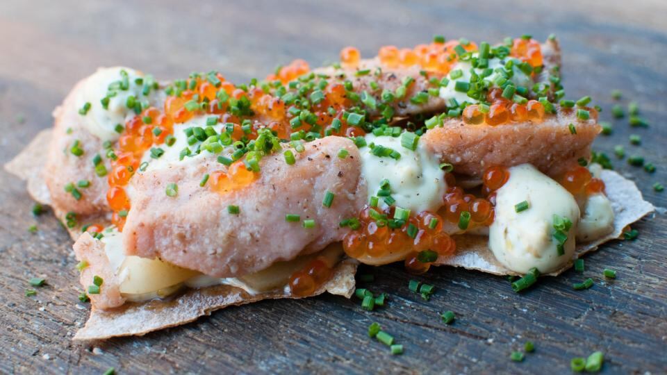 Pickled salmon with capers, potatoes and mayonnaise on crispbread at Speceriet. Photograph: Rob Schoenbaum/New York Times
