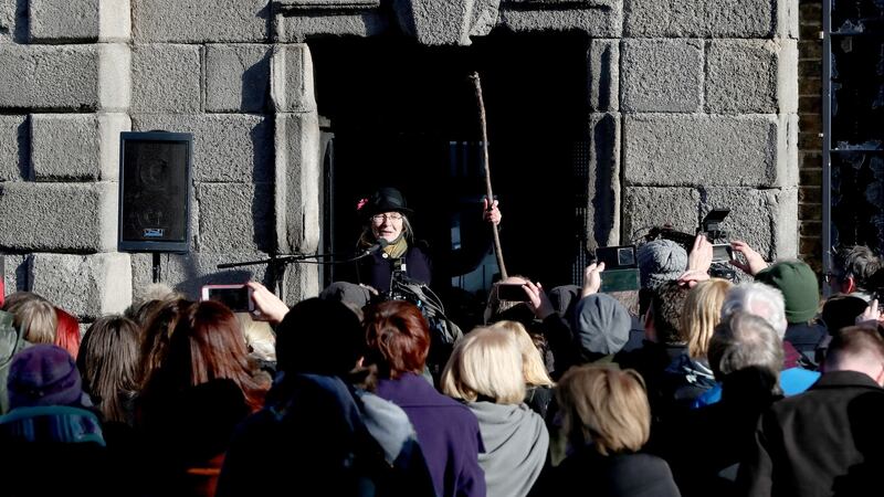 To mark the centenary of women getting the vote in Ireland, Micheline Sheehy the granddaughter of suffragette Hanna Sheehy Skeffington addresses crowds after she re-enacted her grandmother smashing the windows of Dublin Castle to highlight women’s disenfranchisement. Photograph: Niall Carson/PA Wire